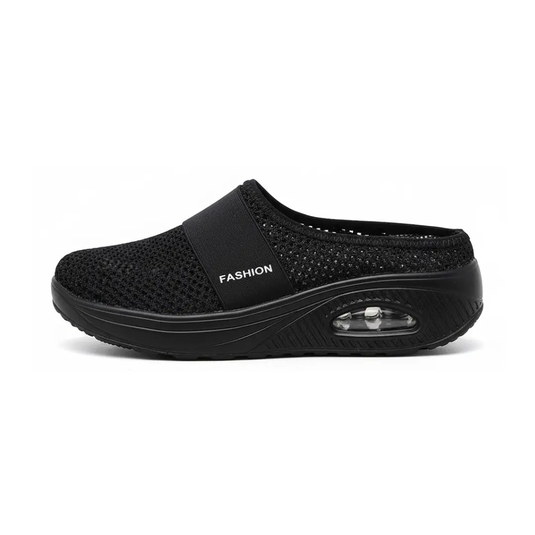 Side view of a single black mesh slip-on sandal showing the elastic strap and the transparent air-cushion window in the thick sole. 23