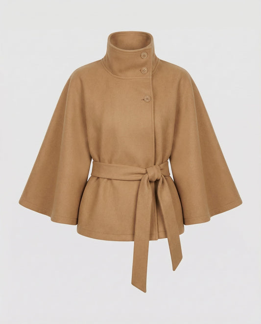 Camel cape jacket with wide flared sleeves, high collar and three buttons, shown flat with the belt tied in a knot at the waist. 1