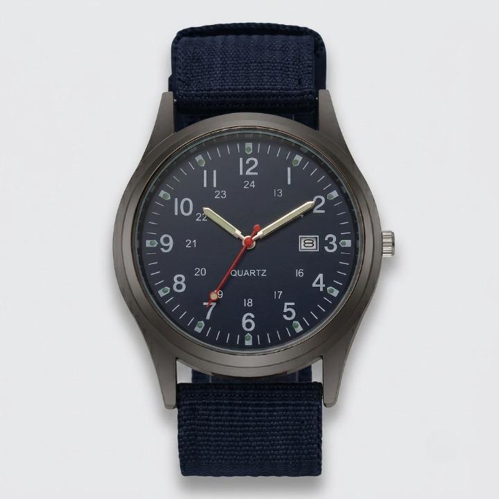 Front view of the watch with a navy blue dial, luminous hands, date window and dark blue woven nylon strap on a plain background. 8