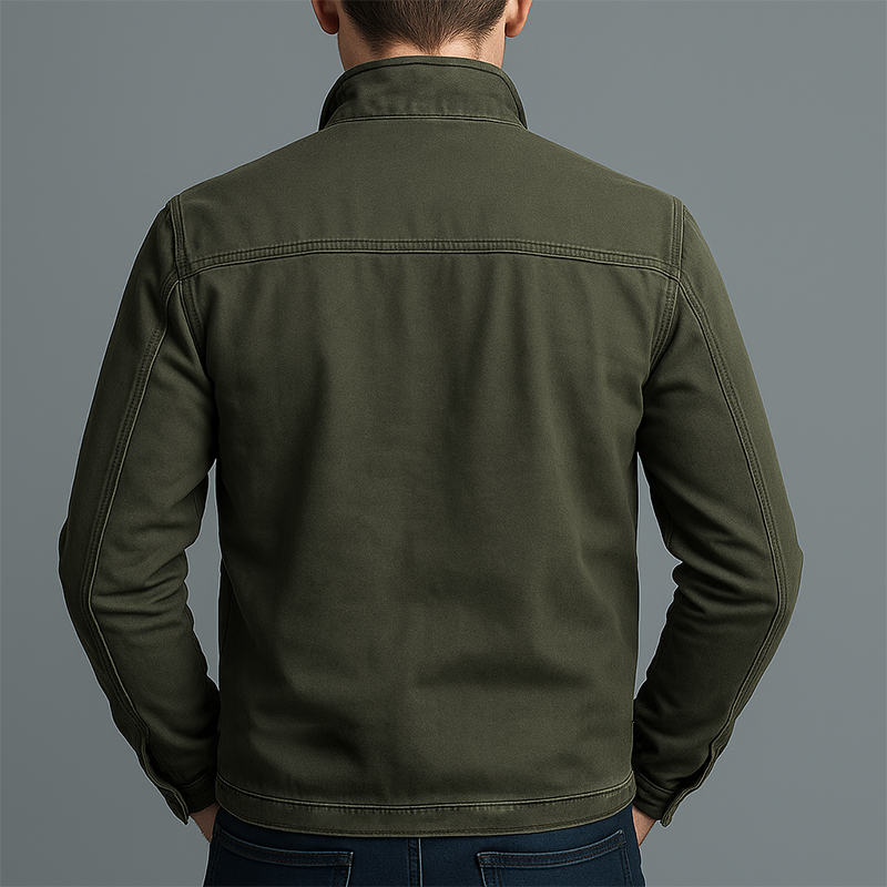 Back view of the olive green jacket on a model, showing the plain back panel, shoulder yoke seam and stitched hem. 3
