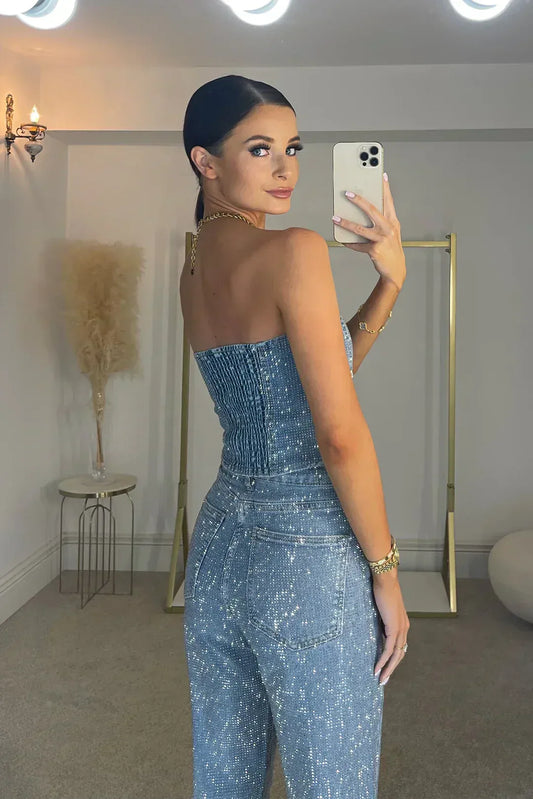 Back view of model in light blue glitter denim set, showing the smocked back panel and pocket 2
