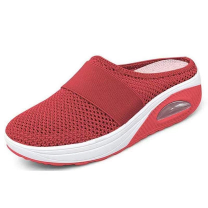 Red mesh backless slip-on with white platform sole and visible air cushion window, side-front view 6