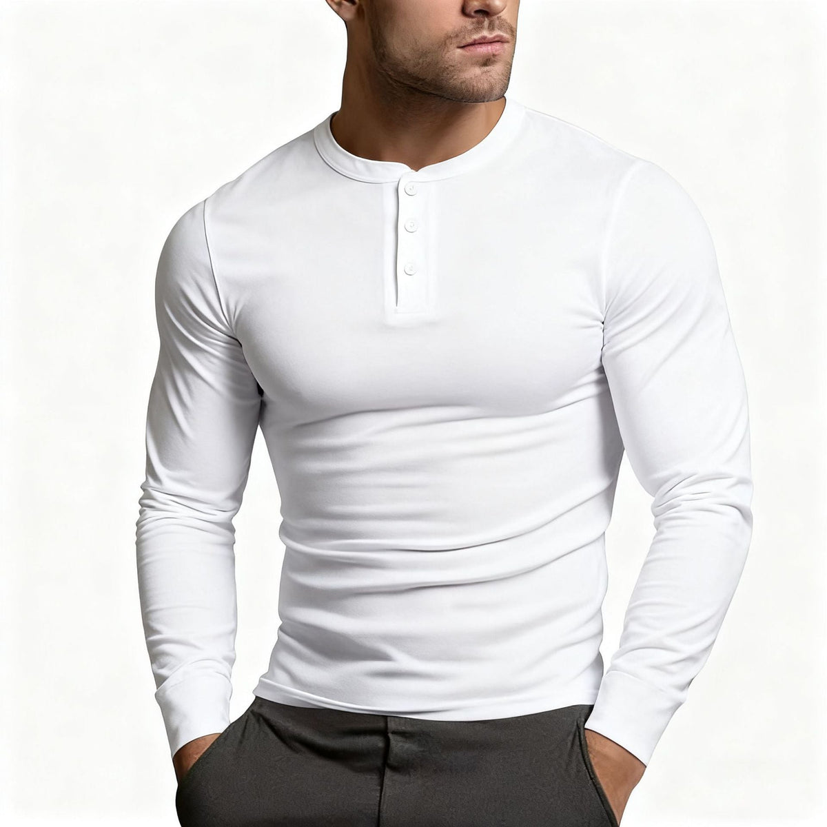 Model wearing the long-sleeve Henley in white, showing the three-button placket and close fit through the chest and arms. 5