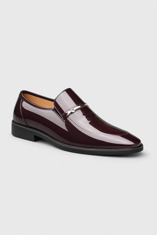Burgundy glossy slip-on loafer in the same style, angled from the front, with a slim metal bar and small stone 2