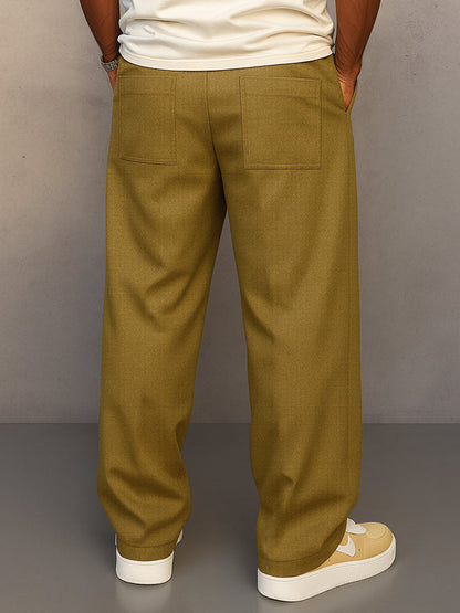 Back view of the mustard olive wide-leg trousers, showing two large patch pockets and the relaxed straight fit. 9