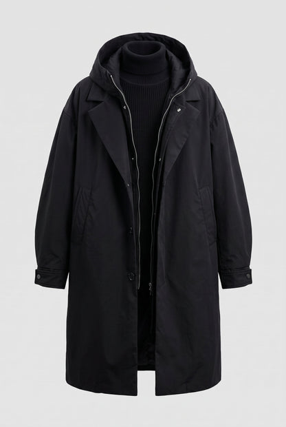 Black hooded coat laid out flat on a plain background, open to show zip, buttons and pockets 8