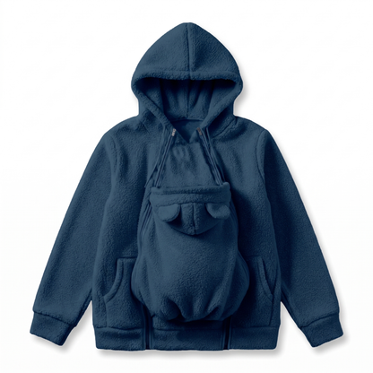 Flat lay of the hoodie in navy blue with the baby carrier panel zipped on, bear ears and front pockets visible. 10