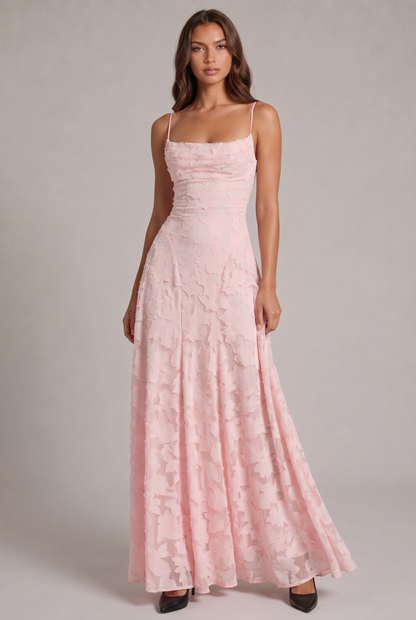 Model wearing the pale pink floral-textured maxi dress with thin straps, full-length front view with black heels. 5