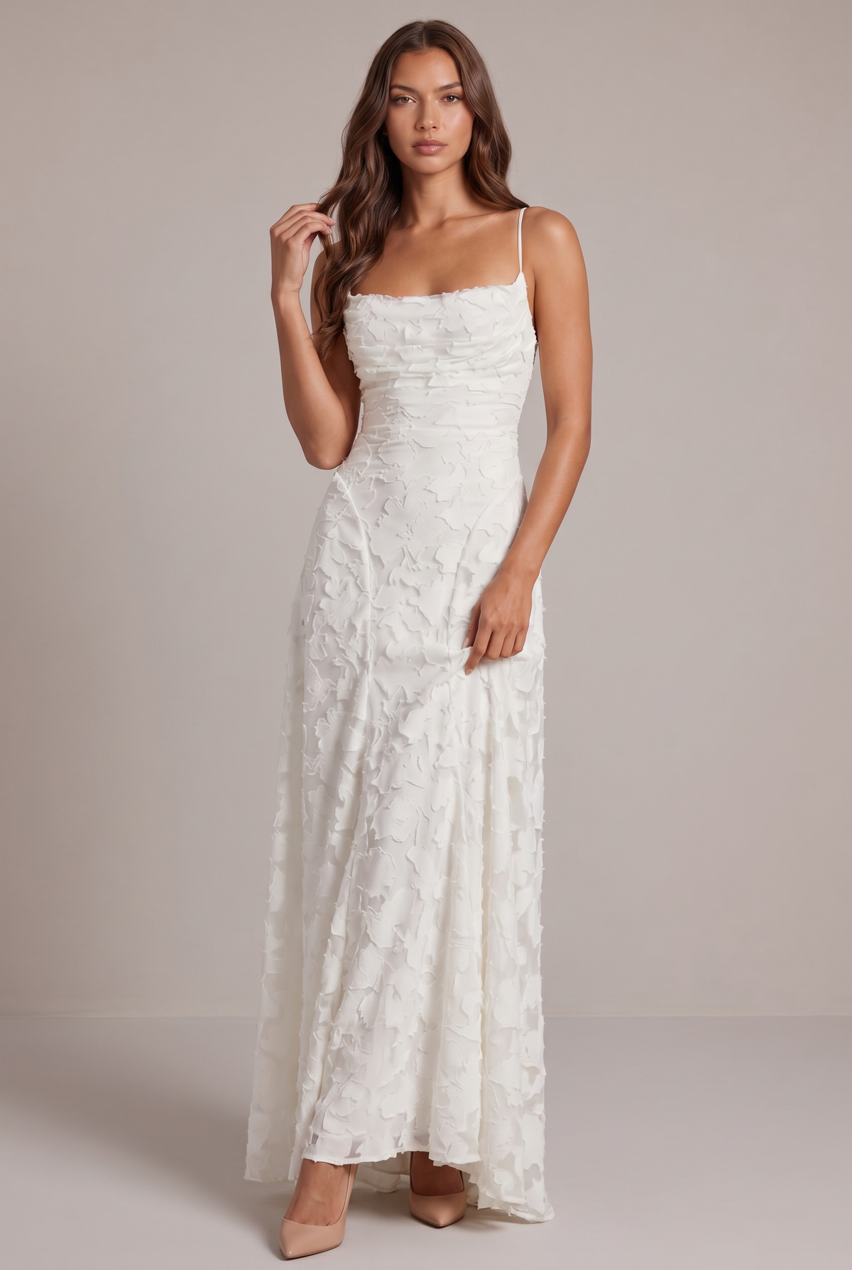 Model wearing the white floral-textured maxi dress with thin straps and nude heels, full-length front view. 9