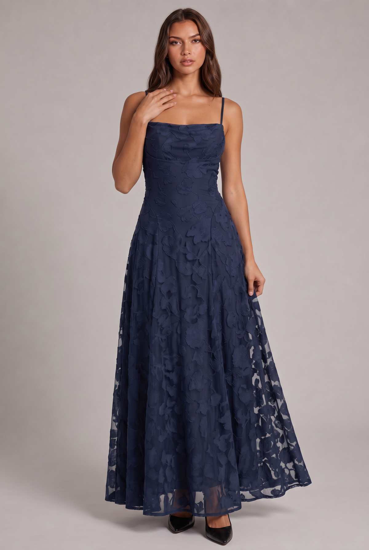Model wearing the navy blue floral-textured maxi dress with thin straps and black heels, full-length front view. 17