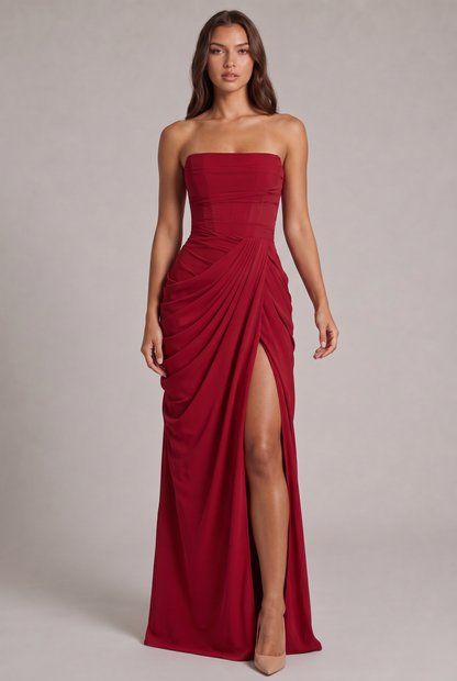 Model in the red strapless maxi dress, full-length front view with draped skirt and thigh-high slit 21