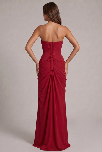 Back of the red dress, showing the lace-up corset back and ruched, gathered skirt 24