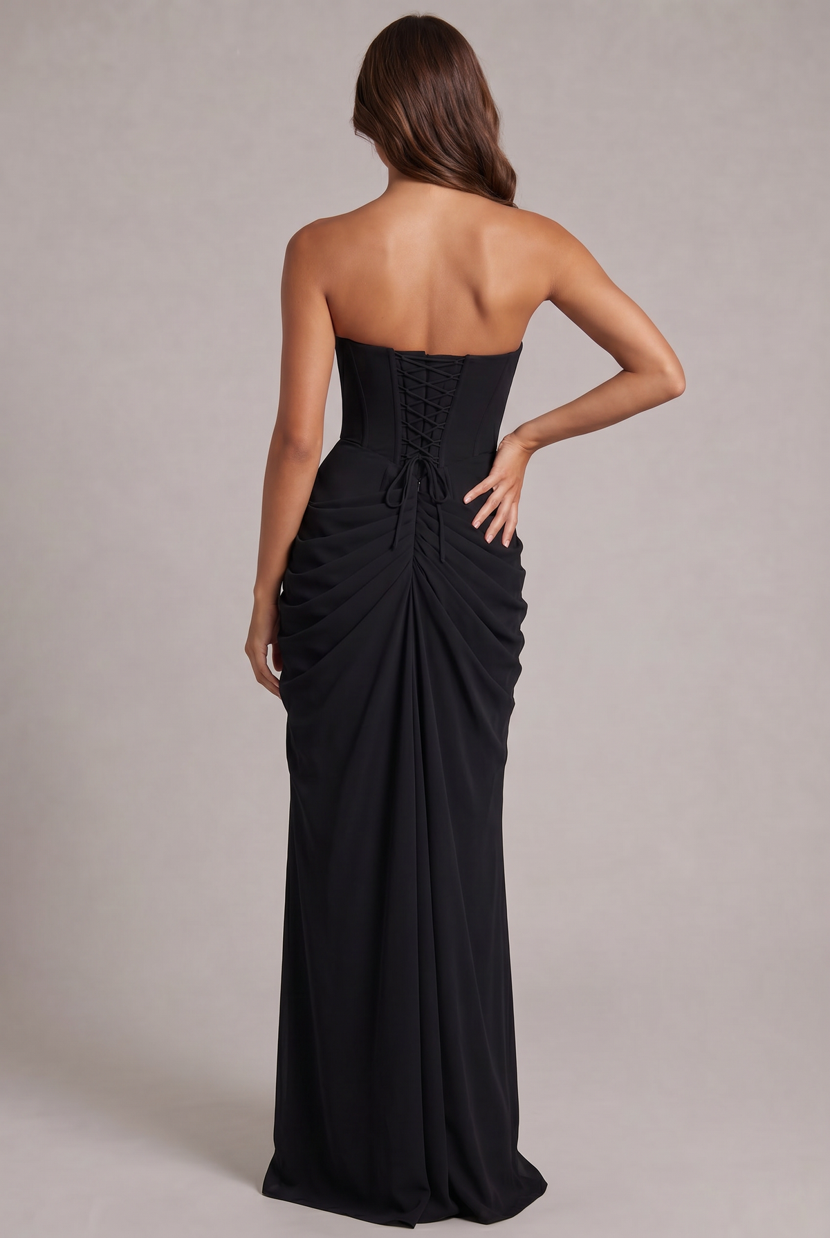 Back view of the black dress, showing the corset lacing and gathered, ruched skirt 28