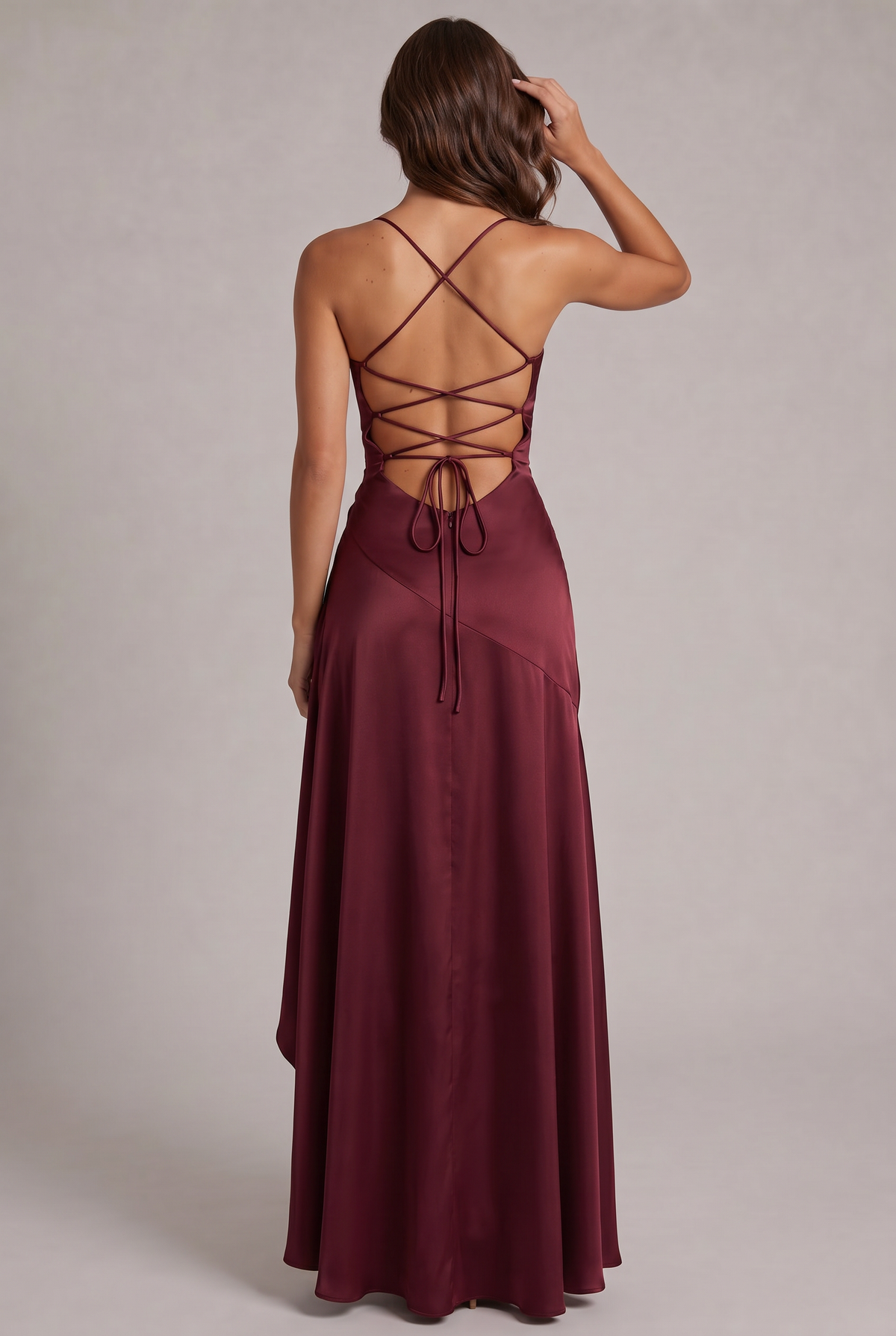 Back of the burgundy satin dress showing criss-cross lace-up straps, tie closure and hidden zip 4