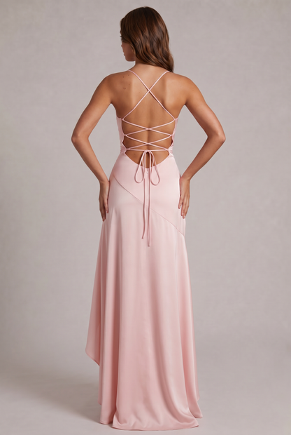 Back of the pale pink satin dress showing criss-cross lace-up straps, bow tie and A-line skirt 20