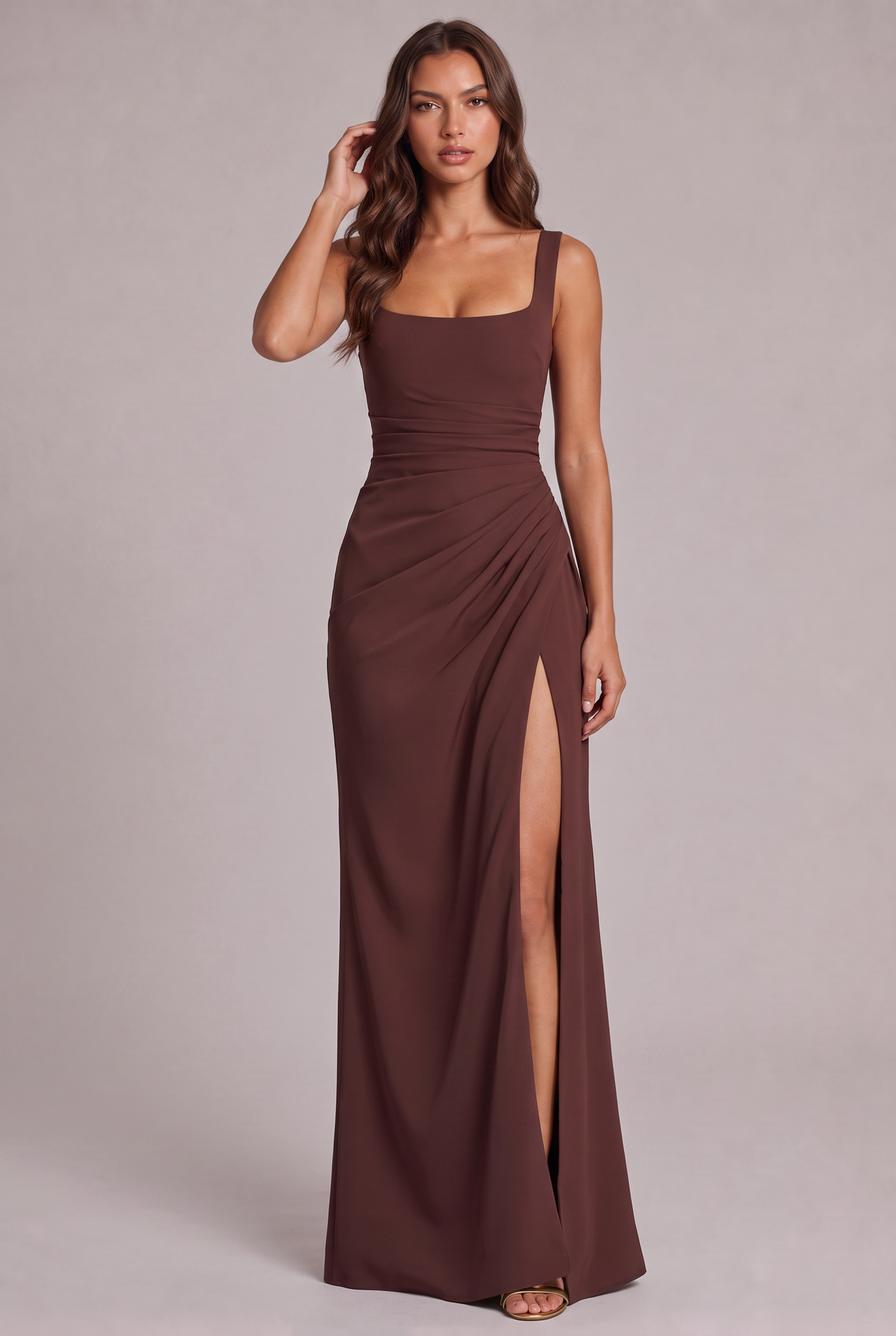 Full-length front view of the chocolate brown maxi dress on a model, with square neckline, ruched waist and high split. 5