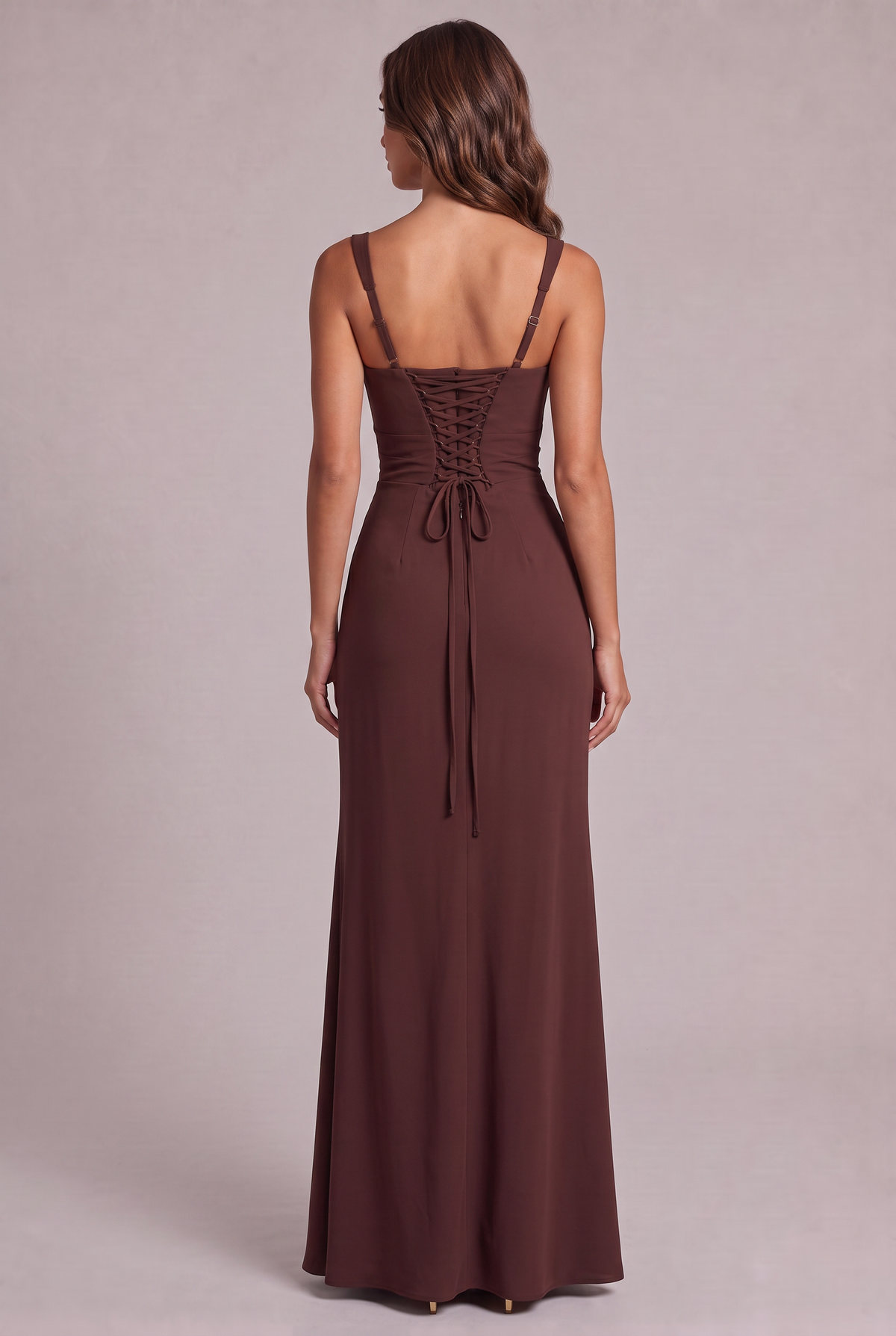 Back view of the brown maxi dress, showing the lace-up corset back, long tie ends and adjustable thin straps. 8
