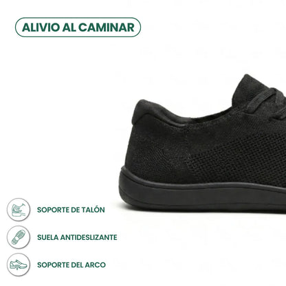 Close-up of the heel of a black trainer beside a Spanish infographic on heel support, non-slip sole and arch support. 13