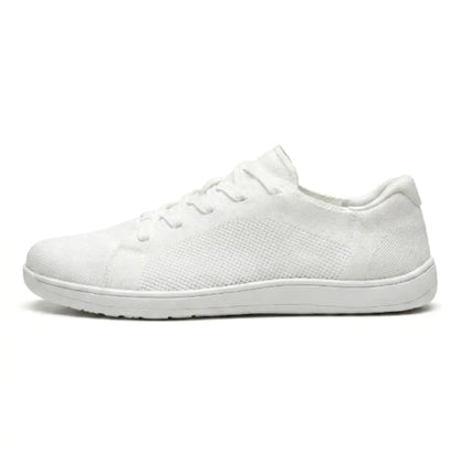 All-white knit trainer with white sole, side profile showing the mesh panel and white laces. 37