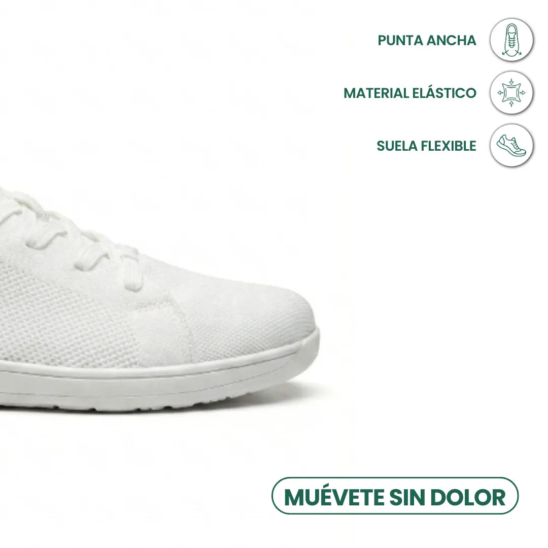 Close-up of the rounded toe of a white knitted lace-up trainer on a flat sole, with feature icons beside it. 41