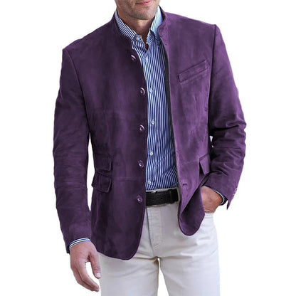 Man wearing the stand-collar button-front jacket in purple over a blue striped shirt and cream trousers, hand in pocket. 3
