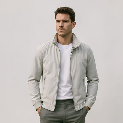 Model wearing the jacket in light grey over a white t-shirt and grey trousers, checked lining showing at the collar. 5