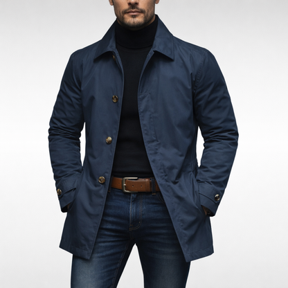 Front view of the same jacket in navy with light brown buttons, worn open over a black roll-neck and jeans. 2
