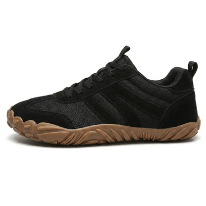 Side view of the all-black version in mesh and suede, with black laces and a tan rubber sole. 19