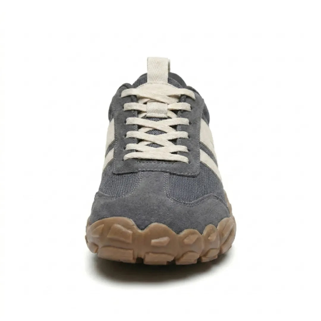 Front view of a grey barefoot shoe showing the rounded toe cap, criss-cross cream laces and tan sole. 8