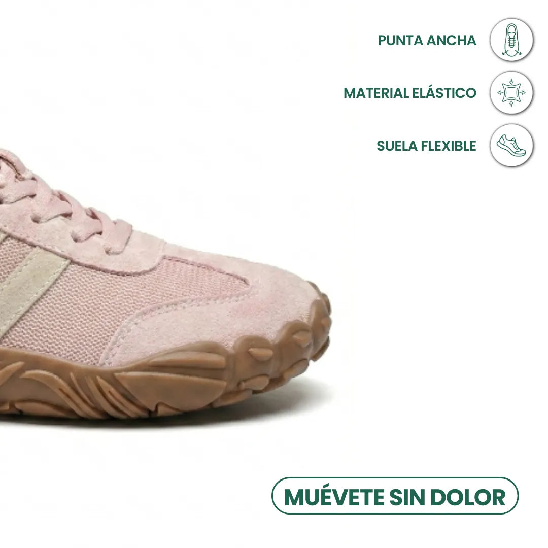 Close-up of the pink shoe's wide rounded toe and flexible sole, with icons for toe room and stretch material. 14