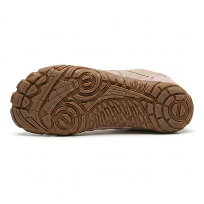 Underside of the pink shoe showing the tan rubber outsole with its textured grip pattern. 18