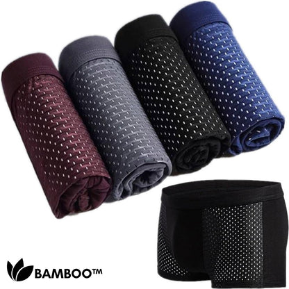 Four rolled boxer briefs in burgundy, grey, black and navy showing the dotted mesh, with one black pair shown flat beside them. 4