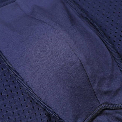 Close-up of the inside of navy boxer briefs showing the soft pouch panel, overlocked seams and mesh side sections. 8