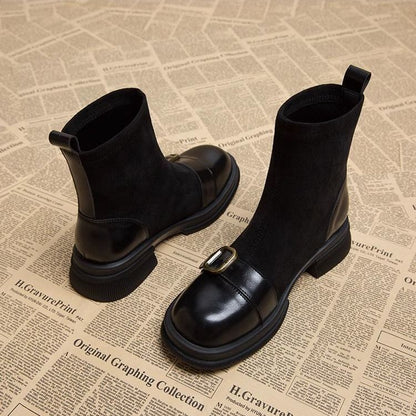 Black version of the suede and leather ankle boots, showing the pull tab, leather heel panel, buckle strap and chunky sole. 4