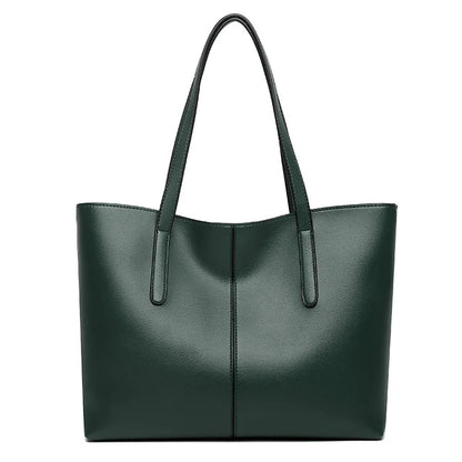 Dark green tote bag seen from the front on a plain white background, with two long straps 7