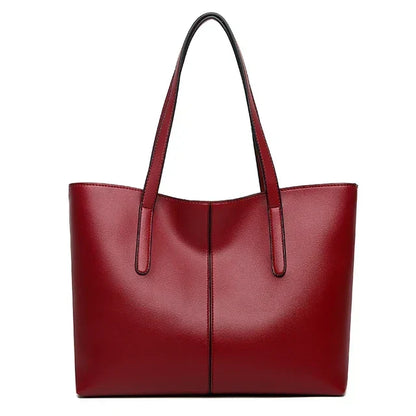 Deep red tote bag seen from the front on a plain white background, with two long straps 8