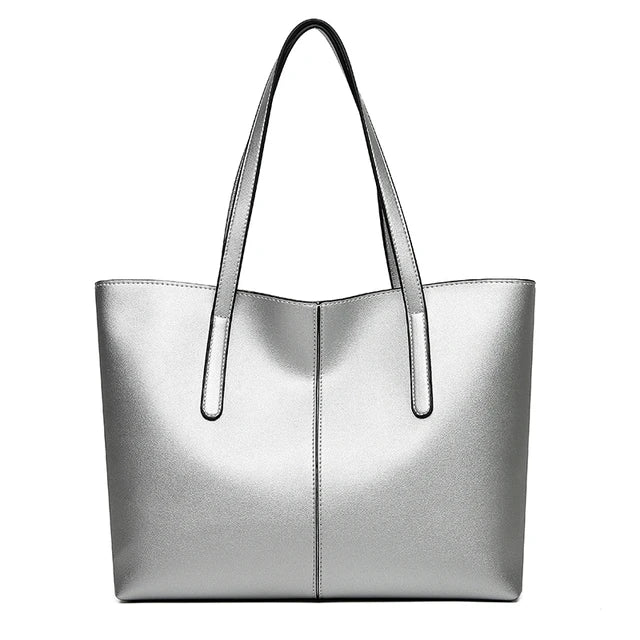 Silver-grey tote bag seen from the front on a plain white background, with two long straps 9