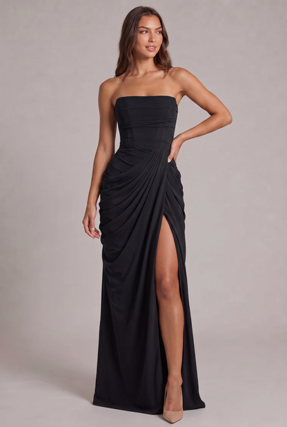 Full-length front view of the black strapless dress, model with one hand on hip 25