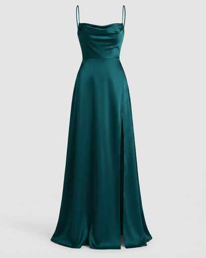Maxi dress in deep teal satin with a cowl neckline, thin straps and a side thigh slit, shown front on. 5