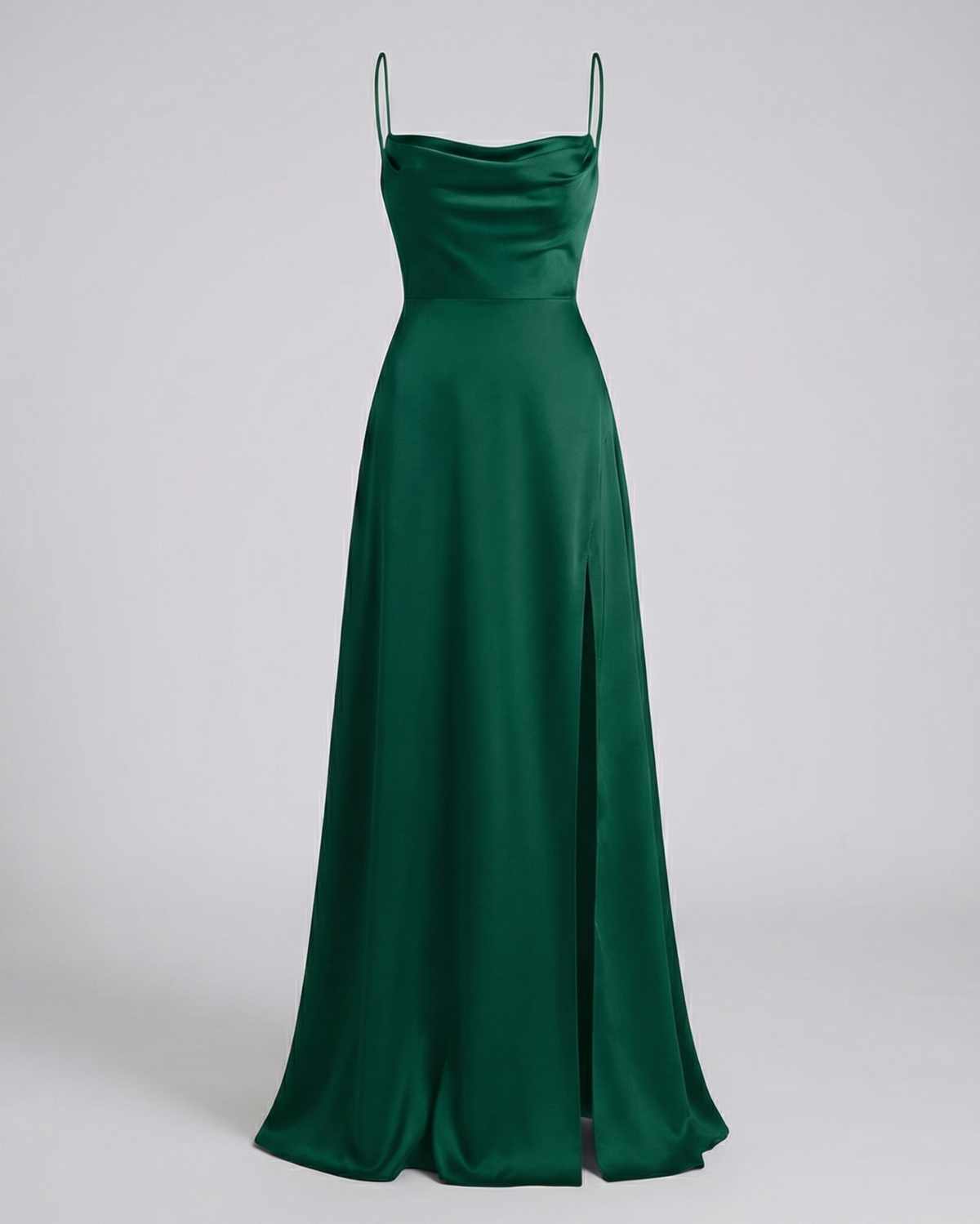 Maxi dress in dark emerald green satin with a cowl neck, thin straps and a side slit, shown front on. 7