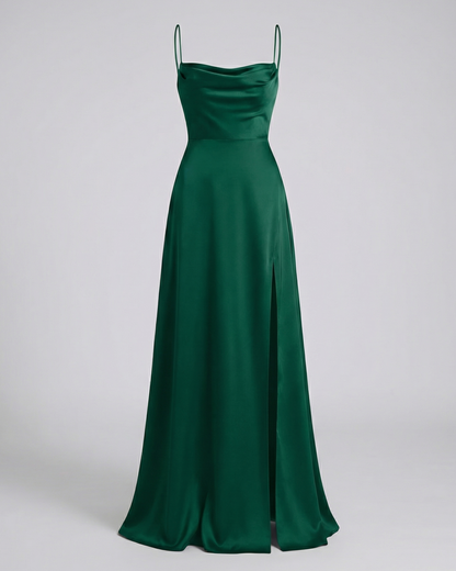 Maxi dress in dark emerald green satin with a cowl neck, thin straps and a side slit, shown front on. 7
