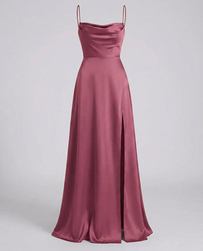 Maxi dress in dusky rose pink satin with a cowl neckline, thin straps and a slit up the side, front view. 8