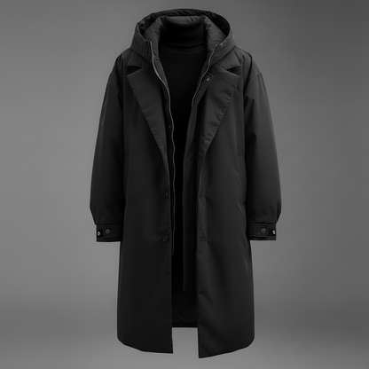 Black version of the long hooded coat shown open on a grey backdrop, with lapels, zip placket, buttoned cuffs and a black jumper beneath. 2