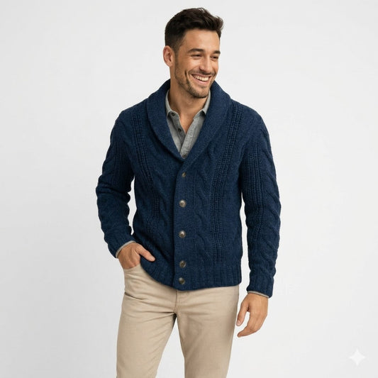 Smiling model in navy cable-knit shawl-collar cardigan, one hand in pocket, against a plain light background 1