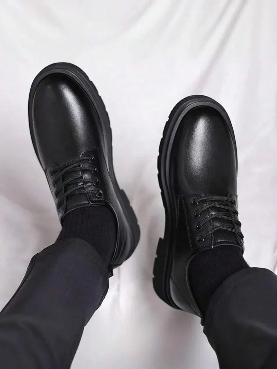 Top-down view of both shoes on feet, showing the glossy toe caps and lacing 4