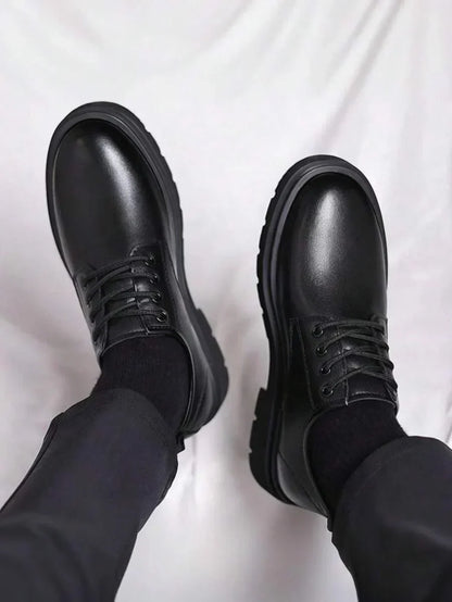 Top-down view of both shoes on feet, showing the glossy toe caps and lacing 4