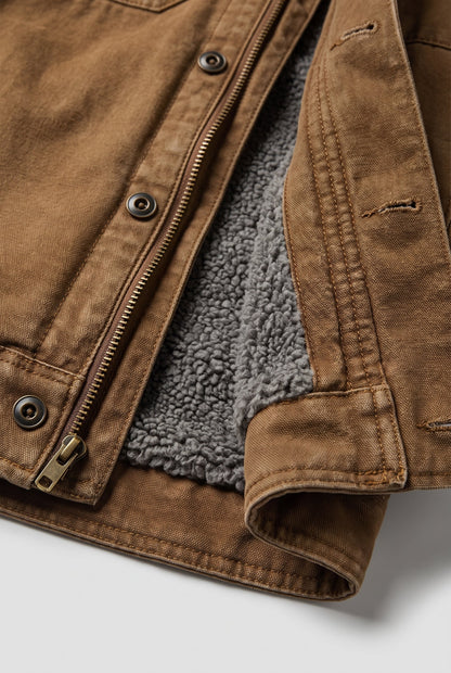 Close-up of the zip, metal snap buttons and grey fleece lining on the tan jacket 4