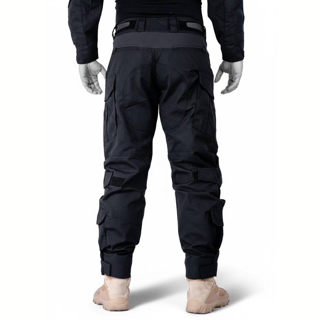 Back view of the black trousers on a model, showing contrast waistband panel, patched seat and calf pockets 10