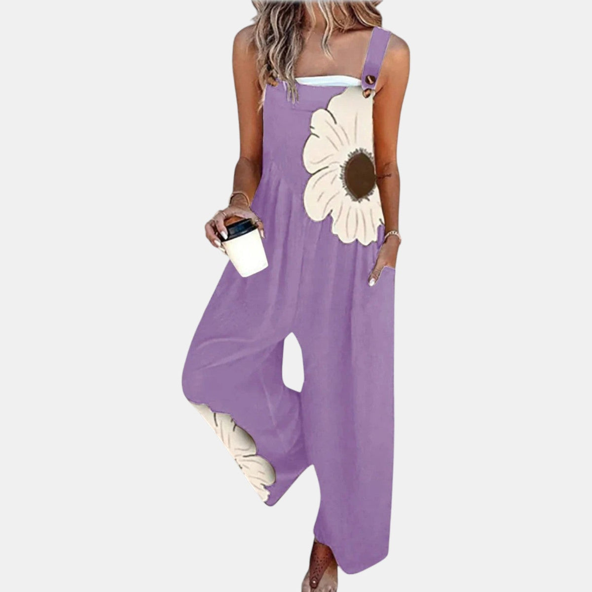 Model wearing purple wide-leg dungarees with a large cream flower on the bib, front view 8
