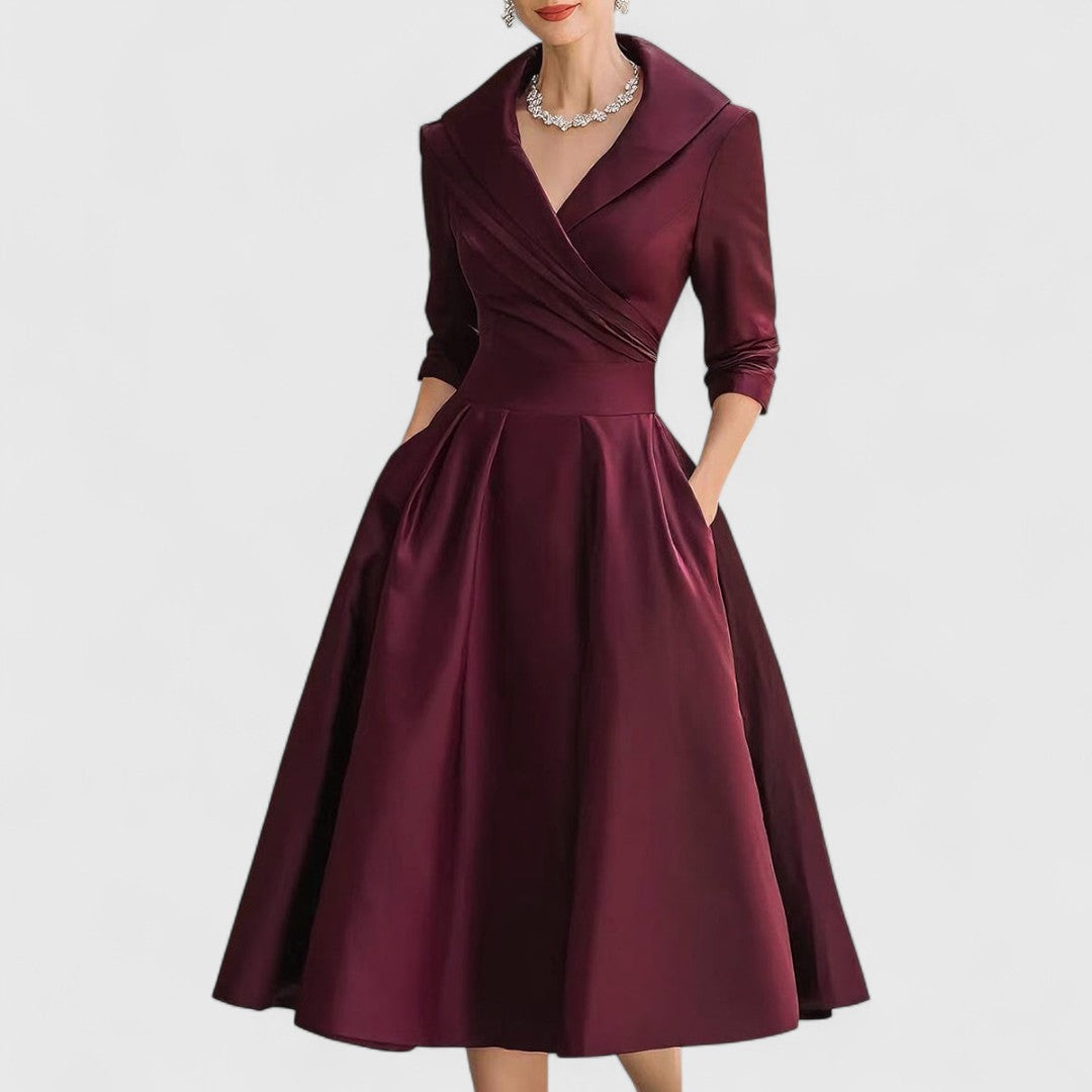 Deep burgundy version of the satin midi dress with draped wrap bodice and hands in the side pockets. 3